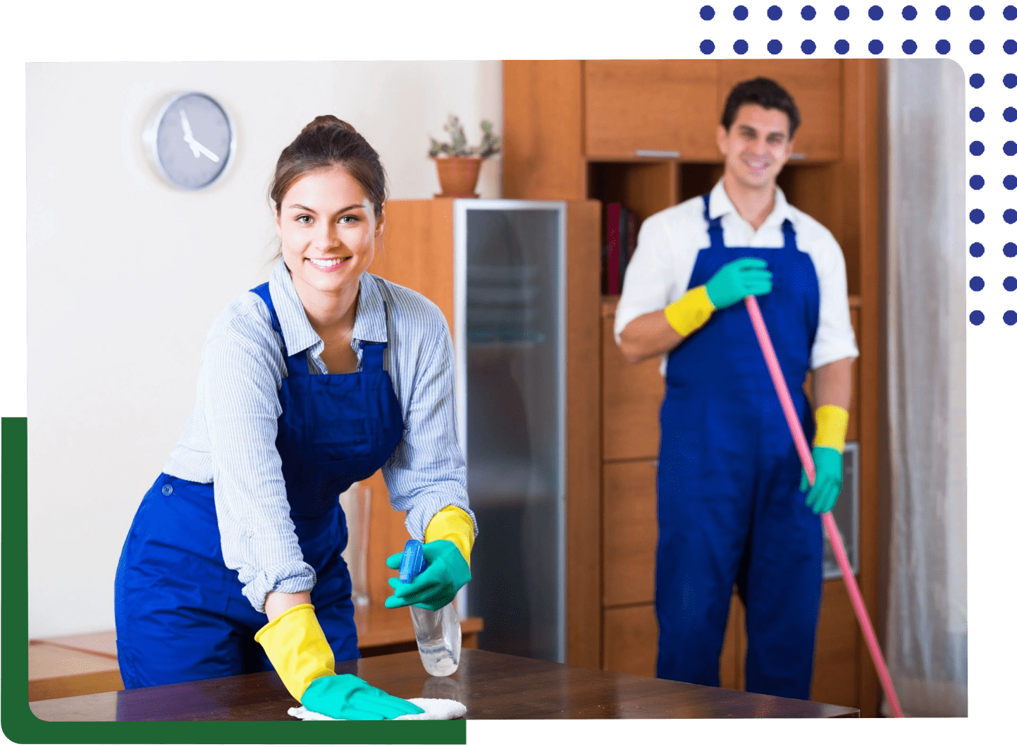 A man and woman cleaning the floor of a room.